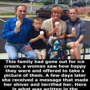 This woman offered to take a picture of a family that seemed very happy that they went for ice cream together