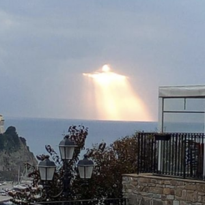 Capturing the Divine: Glowing Figure Resembles Christ the Redeemer Statue