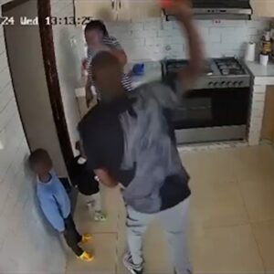 Shocking CCTV Footage Shows Man Attacking Woman in Kitchen as Children Watch in Terror