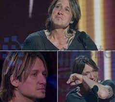 FANS RALLY AROUND KEITH URBAN AFTER HE ASKS THEM TO PRAY FOR HIM.