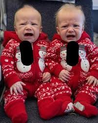 Young woman puts both babies inside the fir… See more